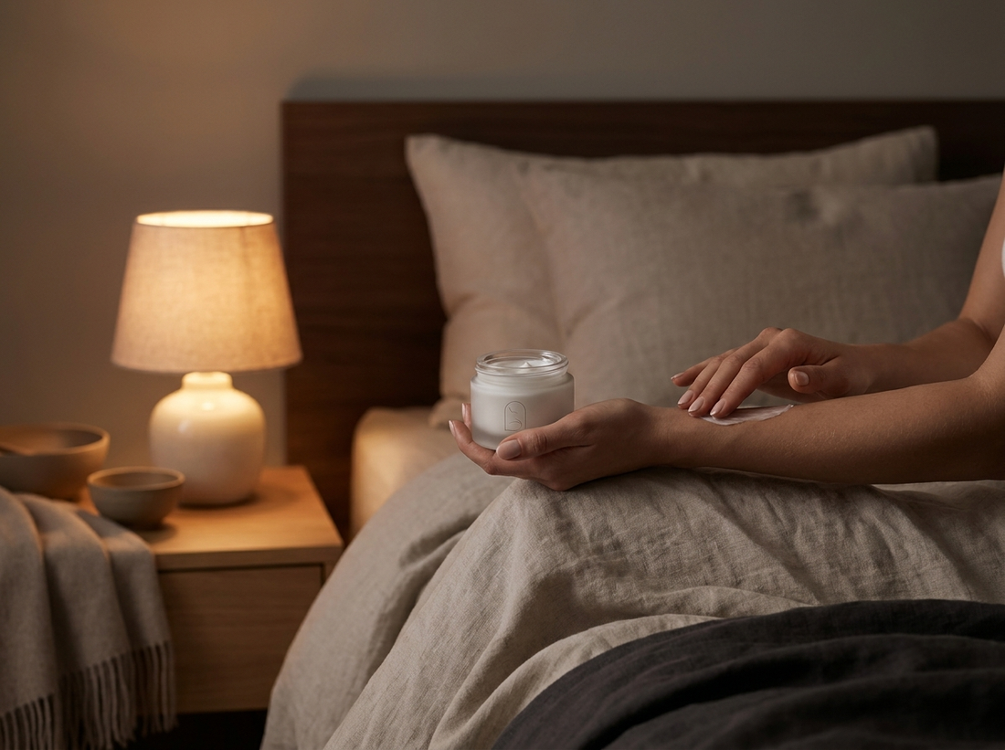 Evening recovery ritual — applying relief cream before bed in a calm, softly lit bedroom